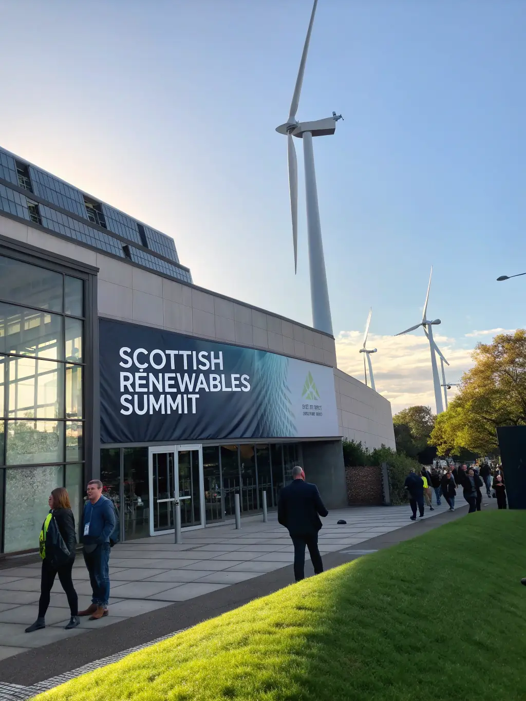 A conference venue in Edinburgh, Scotland, highlighting the 'Scottish Renewables Summit' with wind turbines in the background.